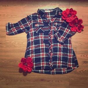 Red, white, and blue flannel shirt.